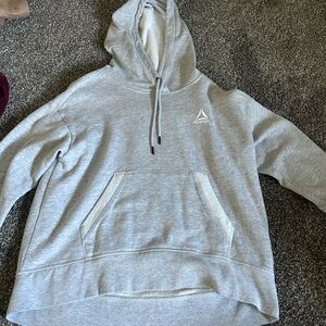 Reebok sweatshirt. Comfy and warm. Fits good, not oversized. Nice material